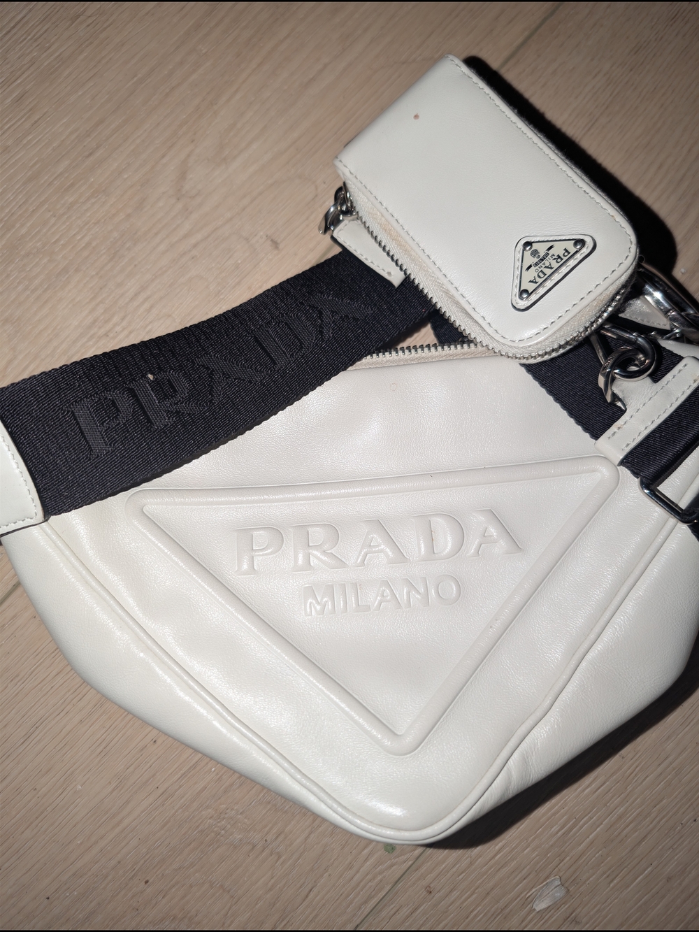 Prada white leather Triangle crossbody bag with a detachable zipped pouch